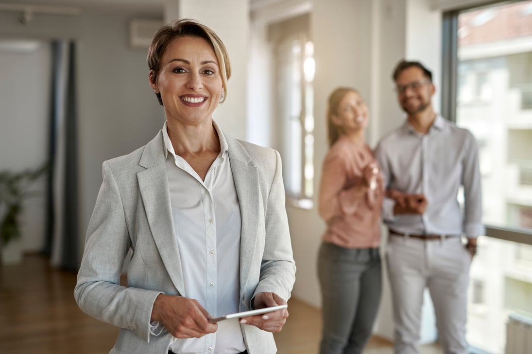 Portrait of happy female real estate agent.